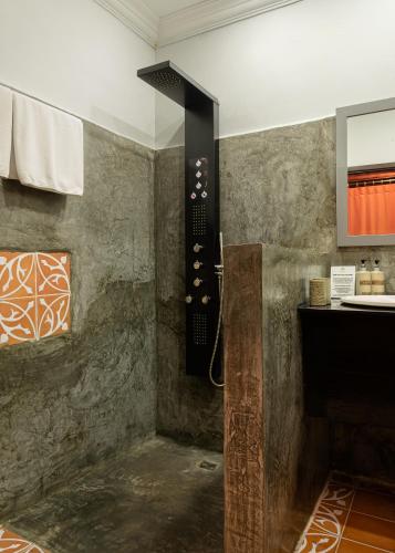 a bathroom with a shower in a room at Pavillon Indochine Boutique - Hotel in Siem Reap