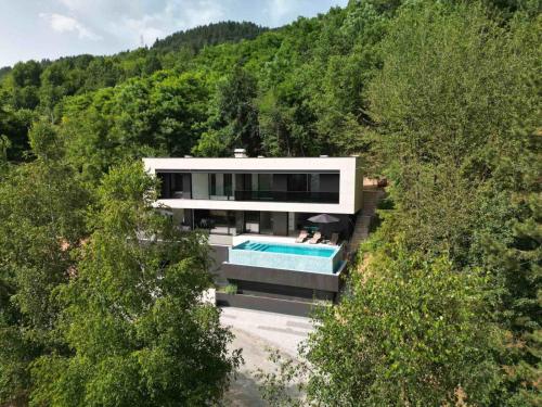 an aerial view of a house with a swimming pool at The Villa O in Sarajevo