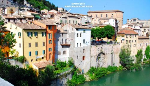 a view of the city and river at Camera con vista in Fossombrone