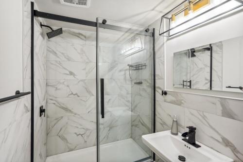 a bathroom with a shower and a sink at Downtown Albany Apartment Walk to Capitol! in Albany