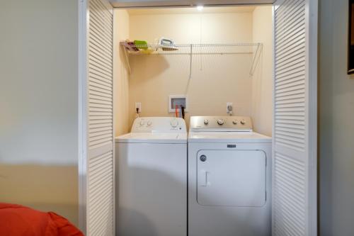 a small kitchen with a white refrigerator and a sink at Ashtabula Vacation Rental with Covered Balcony in Ashtabula