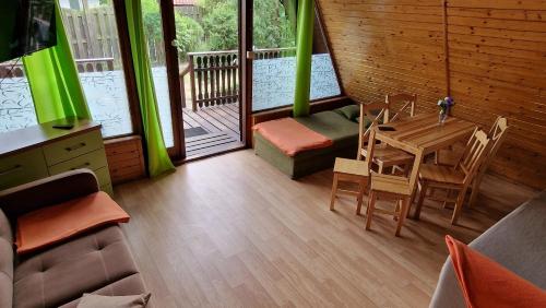 Afbeelding uit fotogalerij van Domki pod lasem blisko morza in Sztutowo