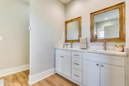a bathroom with a sink and a mirror at Russellville Home Near Hiking and Lake Access! in Russellville