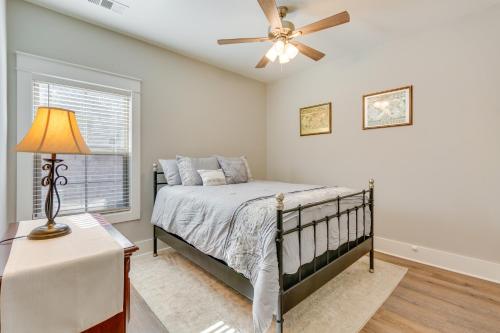 a bedroom with a bed and a ceiling fan at Russellville Home Near Hiking and Lake Access! in Russellville