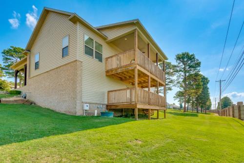 a house with a balcony on the side of it at Russellville Home Near Hiking and Lake Access! in Russellville