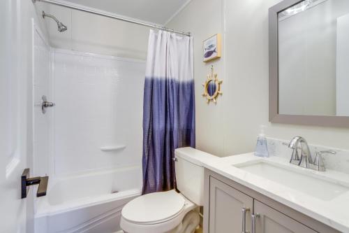 a bathroom with a toilet and a sink and a shower at Port Clinton Vacation Rental with Boat Dock and Grill! in Port Clinton