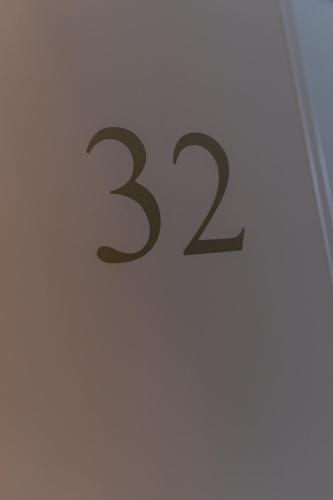 a clock on a wall with the on it at Hotel Seehof Norderney OHG in Norderney