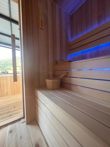 a cabin with a sauna with a blue light at Wild nest Deer Lux in Zlatibor
