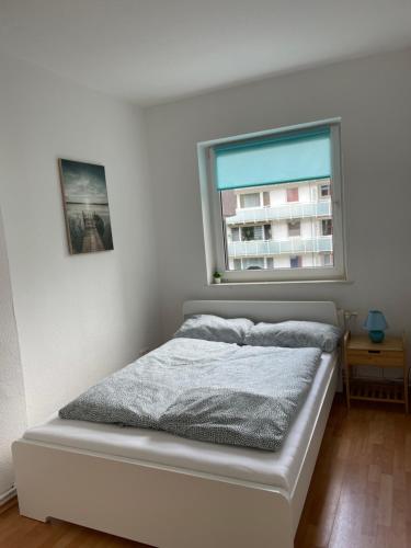 Apartment Nordseeküste tesisinde bir odada yatak veya yataklar