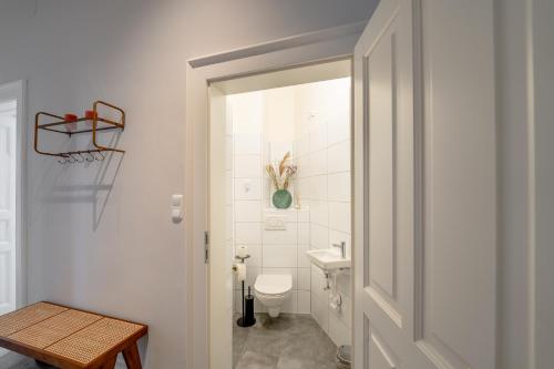 a bathroom with a toilet and a sink at Premium apartment - walking distance to city center in Graz