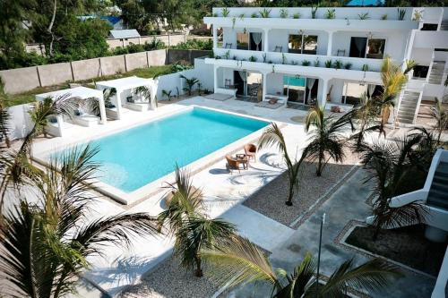 an aerial view of a house with a swimming pool at Antares Villa in Kiwengwa