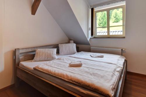 Postel nebo postele na pokoji v ubytování Chata Zadov