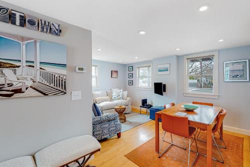 a living room with a table and a couch at The Bradford Bistro in Provincetown