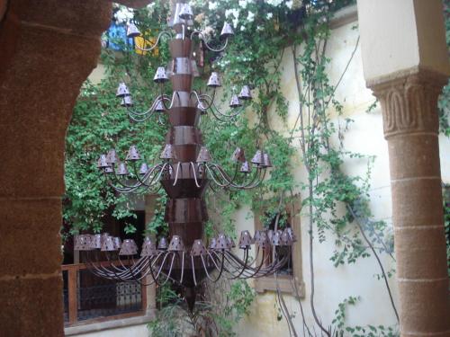 a street light with ivy on the side of a building at Riad Marlinea in Sale