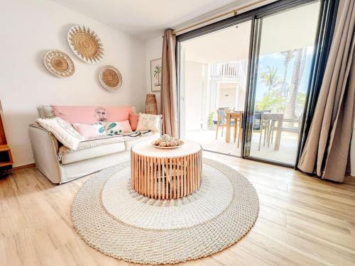 a living room with a couch and a coffee table at Hello Summer large studio on Orient Bay beach in Orient Bay