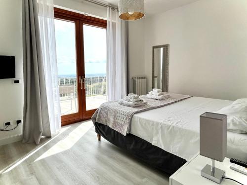 Ένα ή περισσότερα κρεβάτια σε δωμάτιο στο Cape House