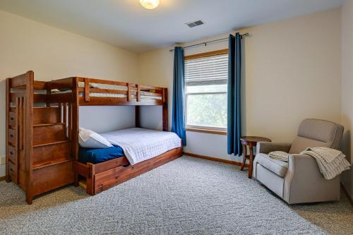 a bedroom with a bunk bed and a chair at Dog-Friendly Baraboo Vacation Rental with Yard! in Baraboo