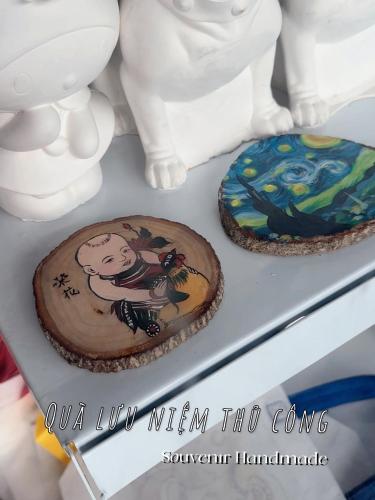 two cakes are sitting on a shelf at Tuần Châu - Phương Đông Motel Hạ Long in Ha Long