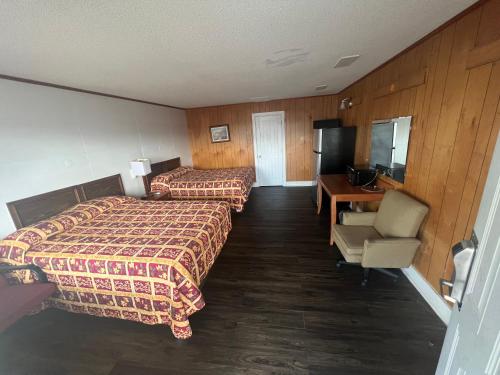 Ένα ή περισσότερα κρεβάτια σε δωμάτιο στο Pinelodge Motel