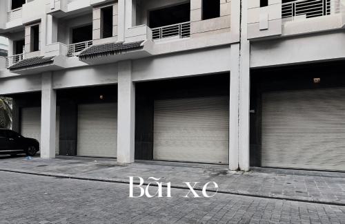 a row of garage doors on the side of a building at Tuần Châu - Phương Đông Motel Hạ Long in Ha Long