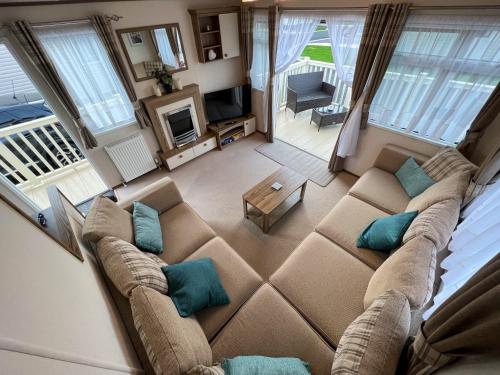 an overhead view of a living room with a couch at Althea, White Horse, Seal Bay Resort in Selsey