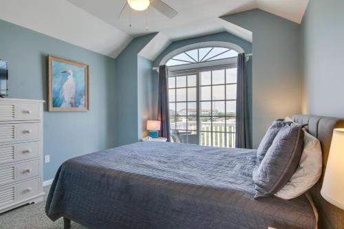 A bed or beds in a room at Idyllic Ocean Block Bethany Beach Retreat with Views