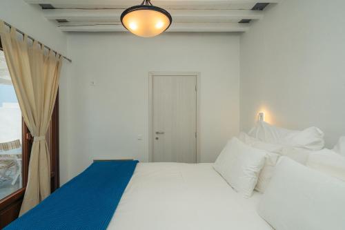 Ένα ή περισσότερα κρεβάτια σε δωμάτιο στο Loukia Apartments