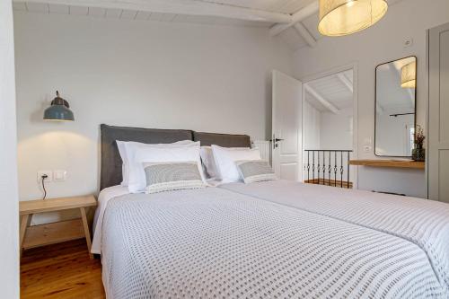 Ένα ή περισσότερα κρεβάτια σε δωμάτιο στο Villa Aurora Paxos