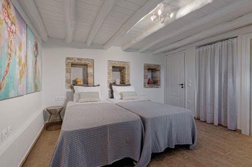Ένα ή περισσότερα κρεβάτια σε δωμάτιο στο Villa Aurora Paxos