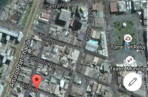 a map of a city with a red marker at wilsonpedro in Iquique