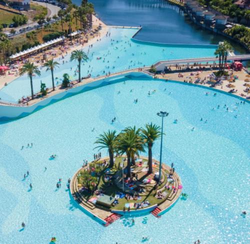 an aerial view of a large swimming pool at a resort at Sweet Home - Praia das Rocas in Castanheira de Pêra