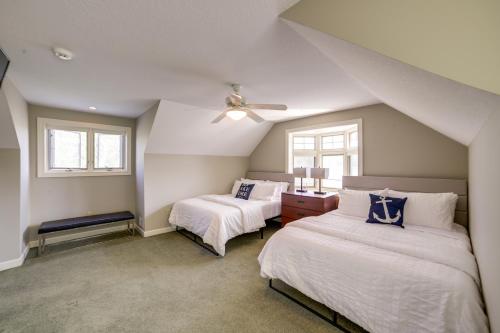 a attic bedroom with two beds and a ceiling fan at Jackson Lakefront Getaway with Balcony, Dock Access in Jackson