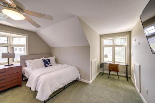 a bedroom with a bed and a dresser and windows at Jackson Lakefront Getaway with Balcony, Dock Access in Jackson