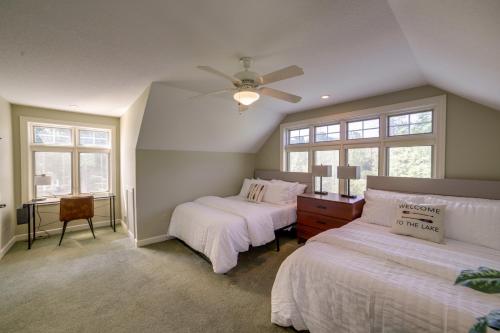 a bedroom with two beds and a ceiling fan at Jackson Lakefront Getaway with Balcony, Dock Access in Jackson