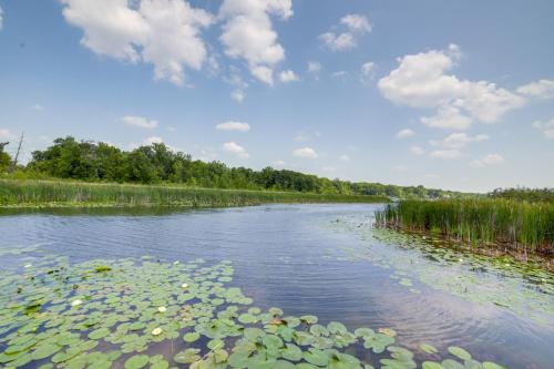 a river with lily pads in the water at Jackson Lakefront Getaway with Balcony, Dock Access in Jackson