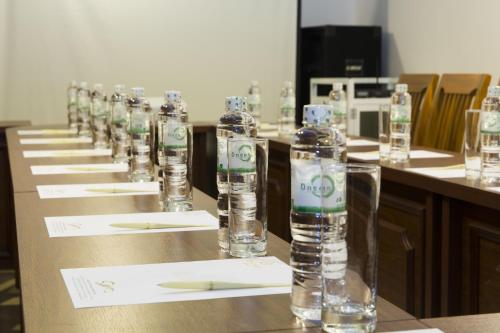 a row of bottles of water on a table at Regalia Nha Trang in Nha Trang