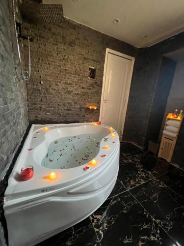 a bath tub with lights in a bathroom at downtown Family Suites in Cairo