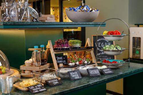 a display of food on a counter in a store at Hotel Das Regensburg in Regensburg