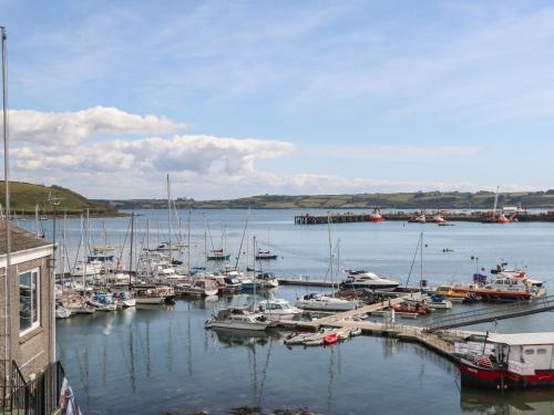 a bunch of boats docked in a harbor at 16 Arwenack Street in Falmouth