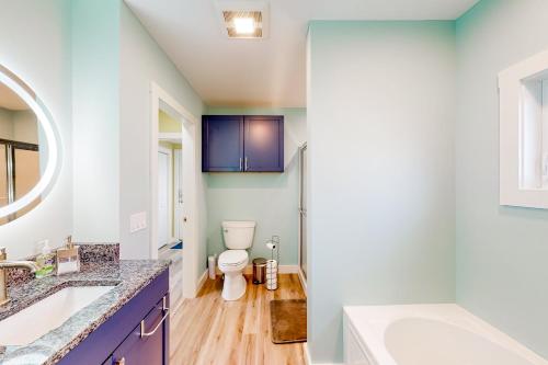 a bathroom with a toilet and a sink at The Owl's Nest in Old Orchard Beach