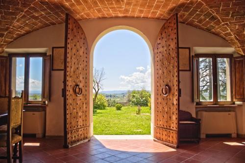 an open door to a room with a view at Villa Brignole in Montaperti