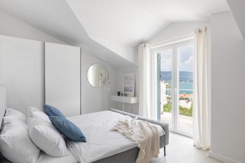 Postel nebo postele na pokoji v ubytování Apartments Marina
