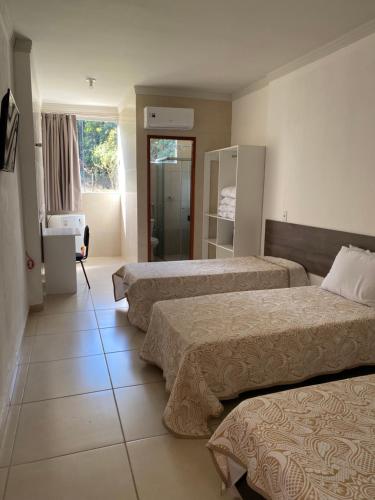 Katil atau katil-katil dalam bilik di Ribeiro Suit's Hotel