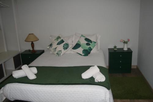 Giường trong phòng chung tại Casa da Oliveira