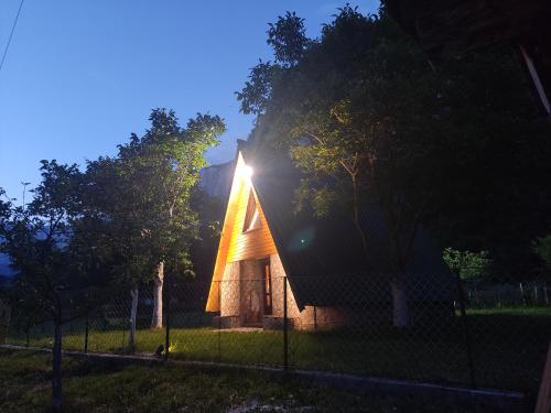 a small house with a light on the top of it at Eco resort Komarnica in Šavnik