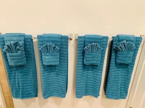 four towels on a rack in a bathroom at Blue Diamond Apt 26th St Unit 2 in Ocean City