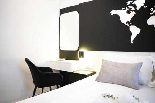 a bedroom with a bed and a world map on the wall at Villa Istra Relax Diamond in Rebići