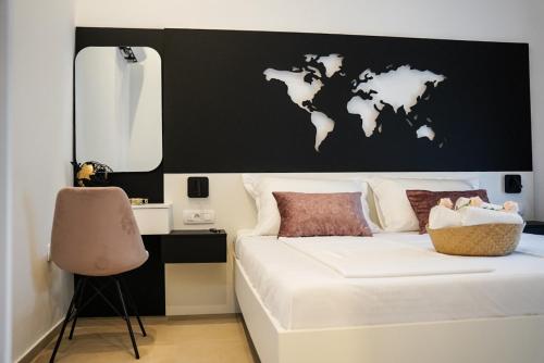 a bedroom with a white bed with a black wall at Villa Istra Relax Diamond in Rebići