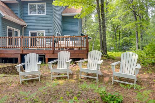 a group of three chairs sitting on a deck at Lakefront Minocqua Getaway Dock, Game Room! in Minocqua