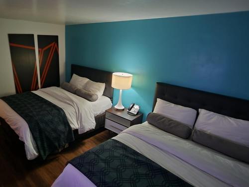 Postel nebo postele na pokoji v ubytování B&J HOTEL AND APARTMENTS